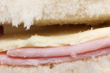 ham and cheese sandwich. bread with cheese and ham. sandwich with selective focus. sandwich details.