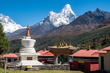 Tibetan Buddhism stupa in Tengboche monastery with beautiful view of Mt.Ama Dablam in the background.