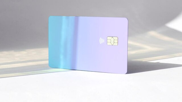 Credit card on a white surface, a symbol of financial possibilities in a clean setting. Credit card on a white surface, representing purchasing power in a minimalist environment.
