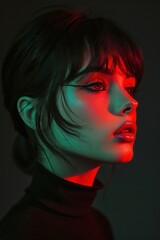 a gorgeous girl with short black hair dressed in a black turtleneck, posed against a black background