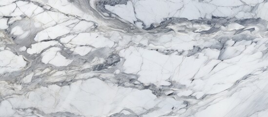 Fototapeta premium A closeup shot of a grey marble countertop resembling a snowy freezing slope in a winter landscape. The white marble looks like snowcovered rock art