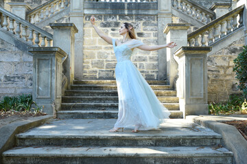 portrait of beautiful female model wearing blue fantasy ballgown, like a fairytale elf princess....