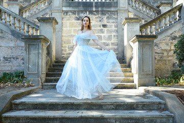 portrait of beautiful female model wearing blue fantasy ballgown, like a fairytale elf princess....