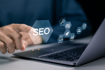 SEO concept, Promoting ranking traffic on website and optimizing your website to rank in search engines. Person use laptop with SEO icon on virtual screen. - obrazy, fototapety, plakaty