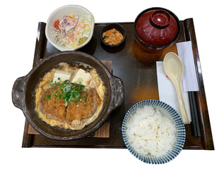 Pan-fried pork katsutoji with eggs and vegetable salad and Japanese rice and miso soup.