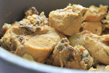Indonesian food called ayam ungkep in an aluminum container