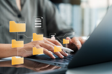 Document management system concept, businesswoman using laptop, folders and document icon software, online document database file management Powerful company information Search and archive.