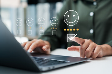 Customer satisfaction survey concept businesswoman use laptop Touch the happy smiley icon. Satisfied. 5 stars. Service experience rating. online application Satisfaction Review best quality. - obrazy, fototapety, plakaty