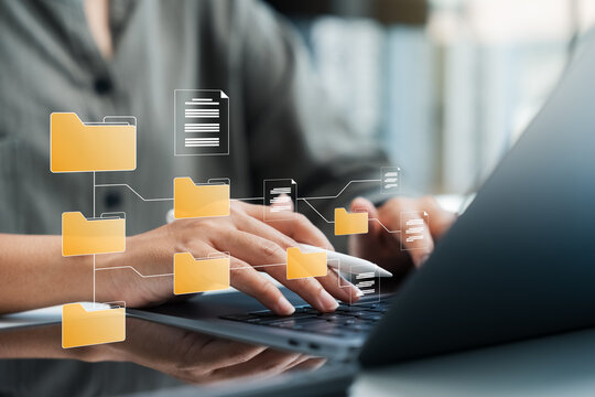 Document management system concept, businesswoman using laptop, folders and document icon software, online document database file management Powerful company information Search and archive.