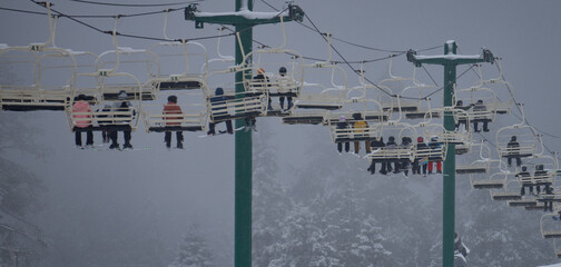 snowboarder on sky lift
