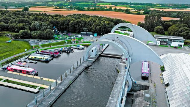 Aerial view of The Falkirk Wheel,  tourist attraction in Falkirk, Scotland. Rotating boat lift connecting the Forth and Clyde Canal with the Union Canal with ships and boats.