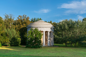 View of the Temple of Friendship on the bank of the Slavyanka River in the Pavlovsky Park on a sunny summer day, Pavlovsk, Saint Petersburg, Russia