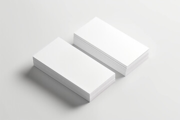 Two plain white business cards placed on top of each other, mock up, copy space