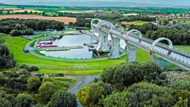 Aerial view of The Falkirk Wheel,  tourist attraction in Falkirk, Scotland. Rotating boat lift connecting the Forth and Clyde Canal with the Union Canal with ships and boats.