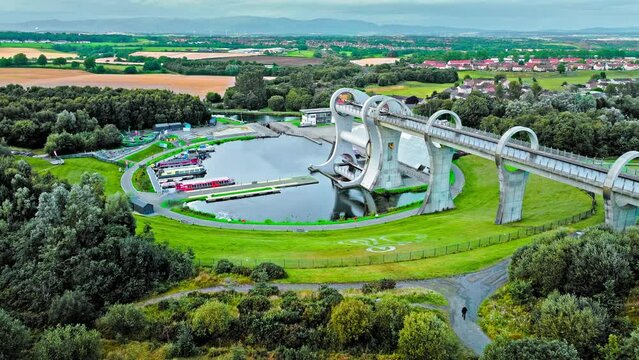 Aerial view of The Falkirk Wheel,  tourist attraction in Falkirk, Scotland. Rotating boat lift connecting the Forth and Clyde Canal with the Union Canal with ships and boats.
