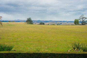 Farmland fields under grey sky