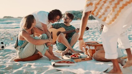 Friends, picnic on beach and guitar for singing with fun outdoor, reunion and people with celebration. Summer, holiday with social gathering or hangout, friendship and party with instrument and music