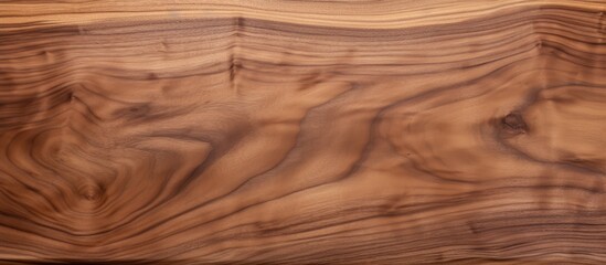 Fototapeta premium A closeup shot of a brown hardwood plank revealing the intricate grain formation, perfect for table, floor, or flooring with wood stain or varnish