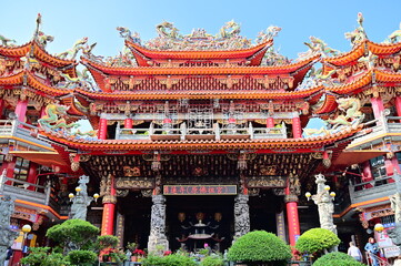 Fototapeta premium Taiwan - Jan 11, 2024: The photo shows Yonglian Temple, a famous Guanyin temple in Luzhou, Taiwan. The temple is known for its square and majestic architectural layout and its gold Guanyin statue.