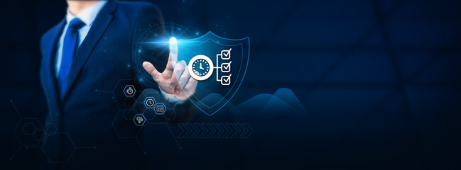 Businessman's hand touches a protective shield symbolizing Time Management. Emphasizing the concept...