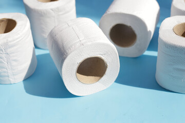 Toilet paper on blue background.