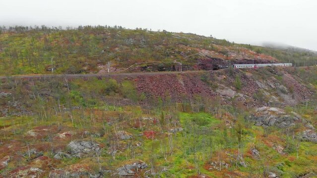 Aerial: Swedish passenger train in northern Norway close to S&oslash;sterbekk station