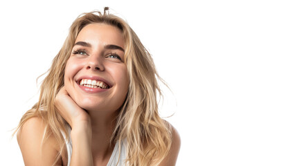 Young blonde woman joyously smiling with hands resting on cheeks against white