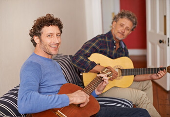 Happy man, portrait and relax with family, guitar or music for acoustic sound or instruments at...
