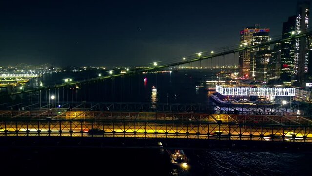 City and vehicle lights, creating mesmerising backdrop from Brooklyn Bridge