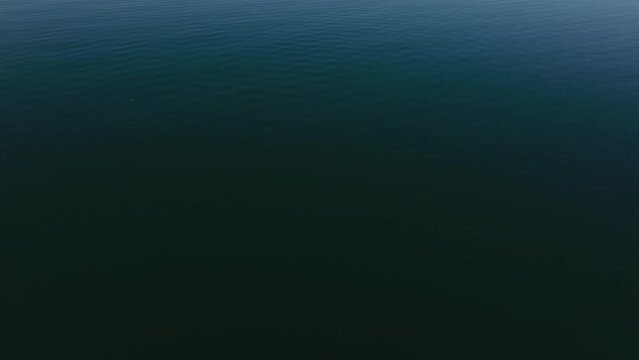 aerial tilt of lake with horizon