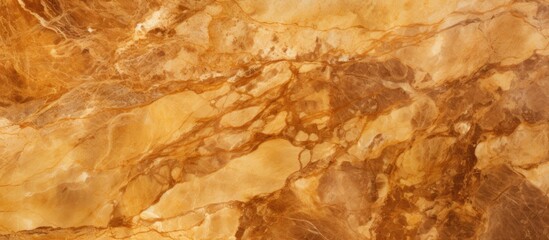 Fototapeta premium A detailed closeup of a brown marble texture resembling amber wood, with a variety of beige, peach, and fur tones in a rectangular pattern