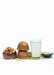 Khejur Ras, Date Palm Liquid Jaggery in a Glass Bowl, Phoenix Dactylifera Fruit and Date Palm Tree Juice Isolated on White Background with Copy Space, Also Known as Date Palm Sap or Khejur Rosh