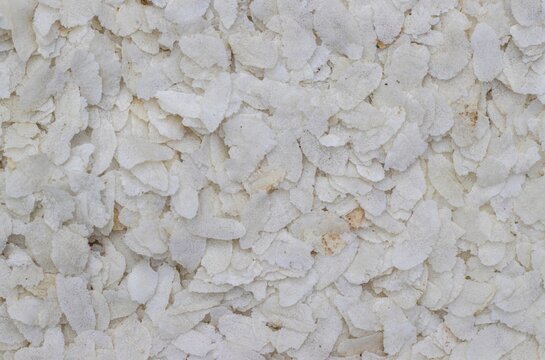 Flattened Rice or Poha Heap Background with Copy Space, Also Known as Chira, Sira or Chivda