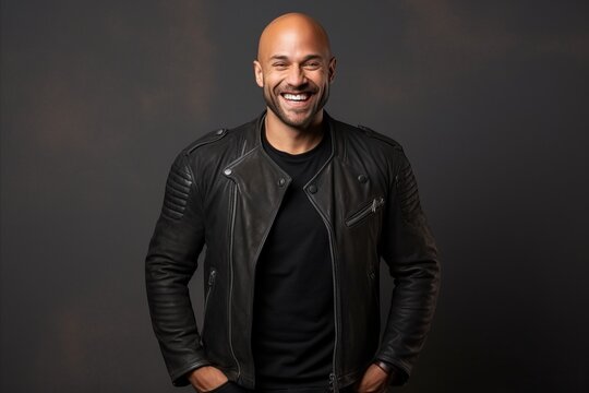 Portrait of a smiling african american man in leather jacket.