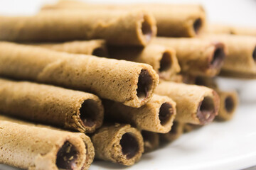 close up of some chocolate wafer rolls
