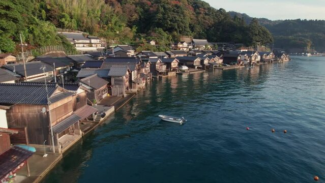Aerial panoramic drone of Japanese Kyotango beach boat houses location blue sea ine town inecho