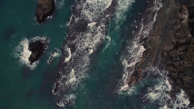 Top down aerial Japanese rock islets blue water waves crushing sea Kyotango kyoto beach japan travel destination