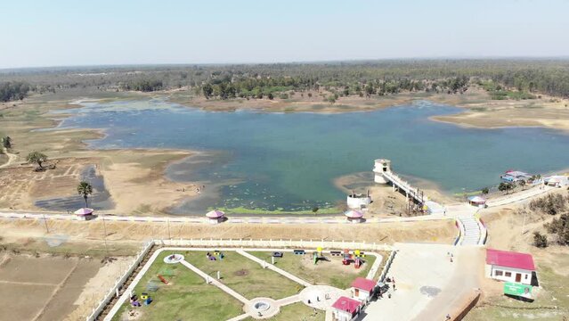 Aerial shot of beautiful park inaugurated by Hemant Soren in Lakshanpur dam in Chatra, Jharkhand, India with beautiful blue water lake.