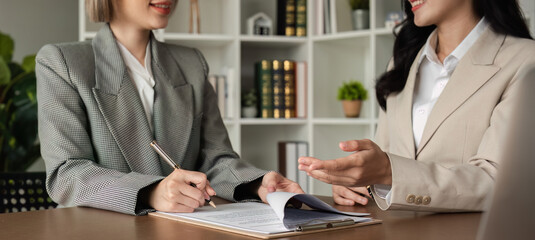 Lawyer and businesswomen discussing and introducing Providing legal advice regarding signing...