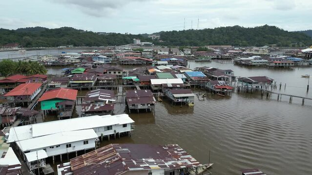 aerial drone shots of houses on stilts on the river in the floating villages of Kampong Ayer in Bandar Seri Bagawan in Brunei Darussalam
