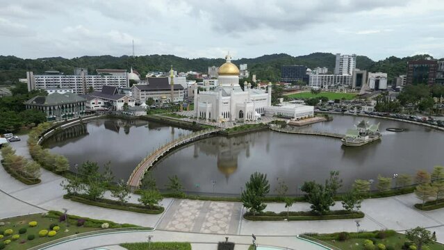 Aerial drone shot of beautiful garden complex in front of the Sultan Omar Ali Saifuddien Mosque in Bandar Seri Bagawan in Brunei Darussalam
