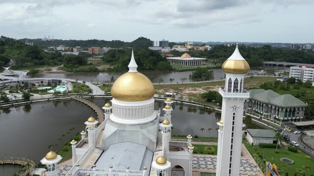 Aerial drone shot of golden minarets and dome on the Sultan Omar Ali Saifuddien Mosque in Bandar Seri Bagawan in Brunei Darussalam
