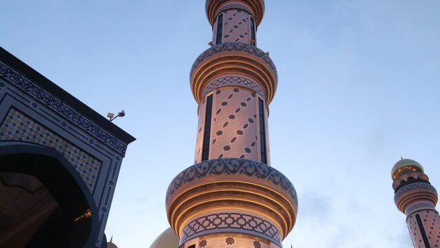 elegant intricate islamic art on a towering minaret at Jame' Asr Hassanil Bolkiah Mosque in Bandar Seri Bagawan in Brunei Darussalam during dusk