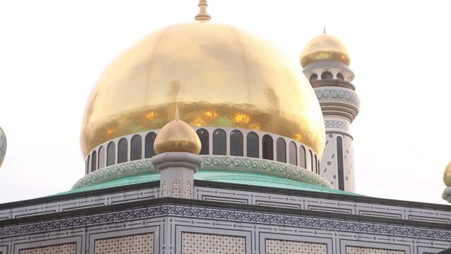 bright iconic golden dome of Jame' Asr Hassanil Bolkiah Mosque in Bandar Seri Bagawan in Brunei Darussalam