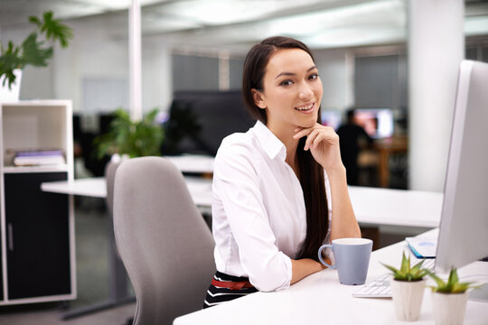 Office, smile and portrait of woman with monitor at desk for research, report review or administration. Happy, face and employee with technology for hr, compliance and ready for work with coffee