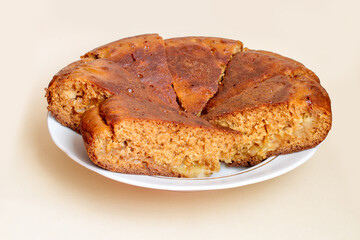 Sliced homemade apple pie on a plate. Fresh homemade baked goods close-up.