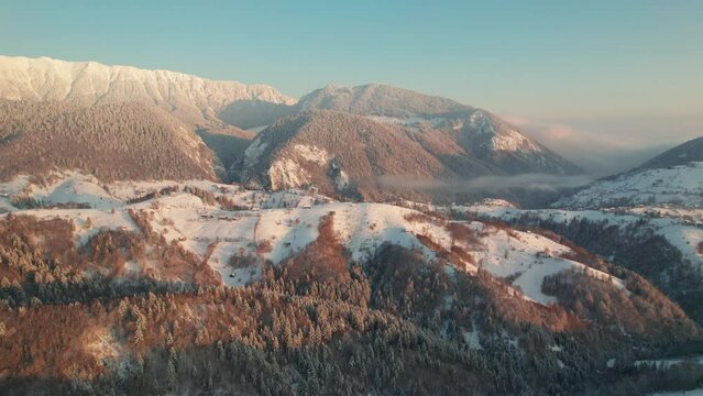 Serene Pestera Village nestled in Piatra Craiului Mountains at sunrise, mist hugging the landscape
