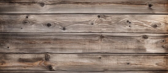Fototapeta na wymiar A detailed shot of a brown hardwood plank wall, showcasing the wood grain pattern and wood stain finish, with a blurred background