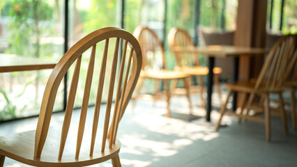 A cozy style wooden chair and dining table with window sunlight as background. Interior furniture...