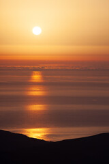 Seascape. Orange sunset at the sea with sun
